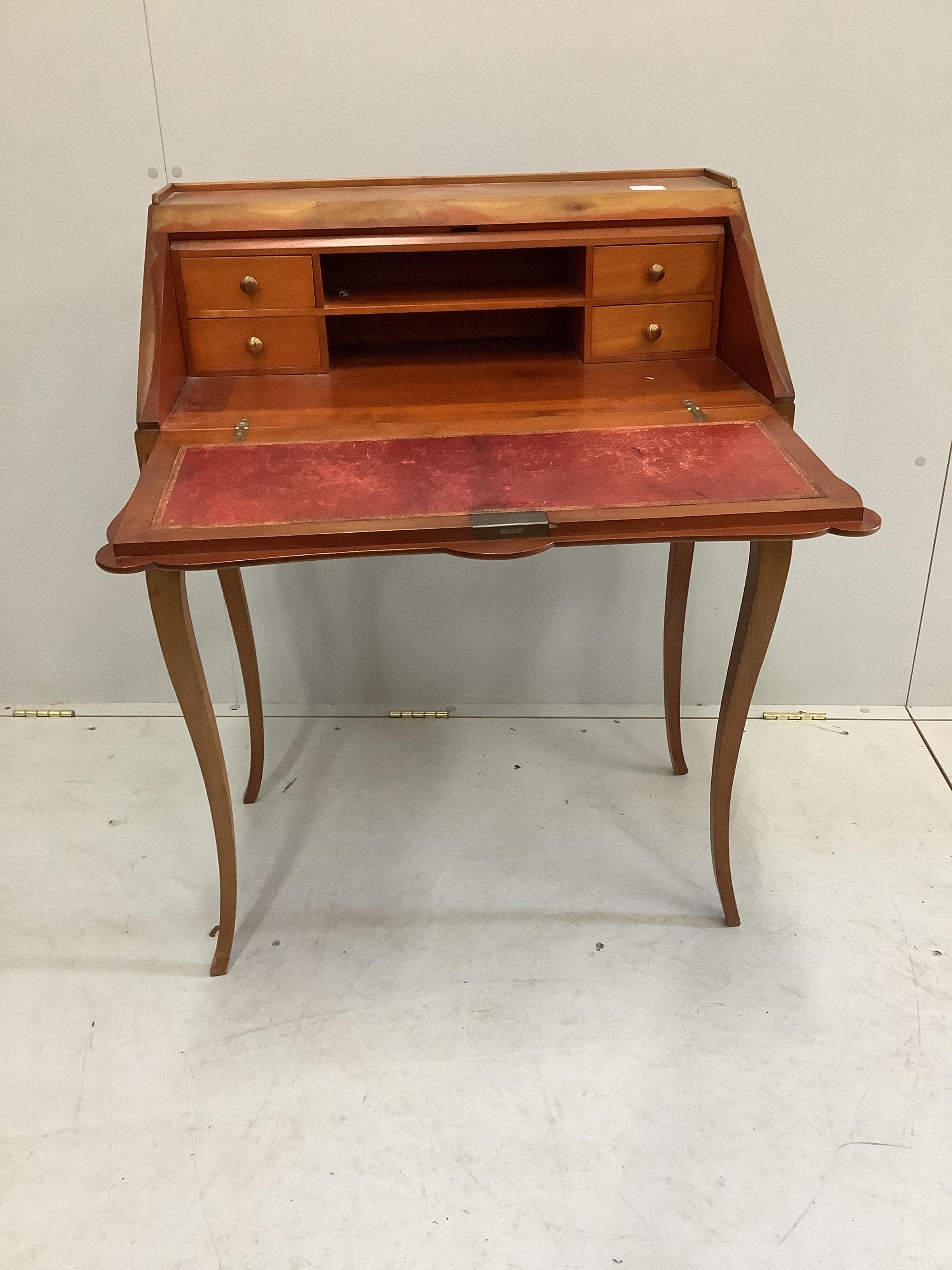 A Louis XV style walnut bureau de dame, width 69cm, depth 42cm, height 92cm